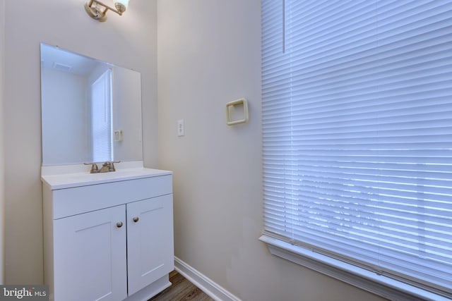 bathroom featuring wood-type flooring and vanity