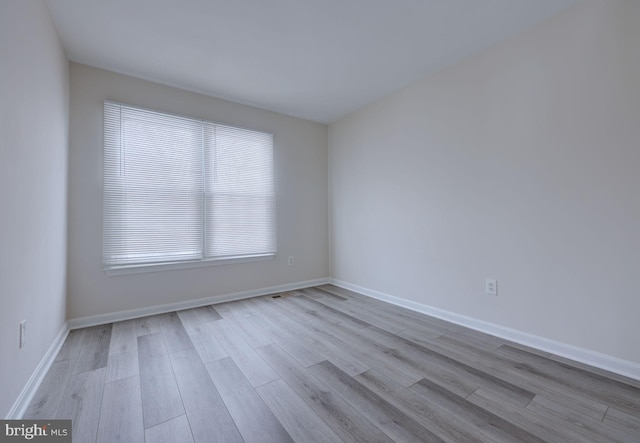 unfurnished room featuring light hardwood / wood-style flooring