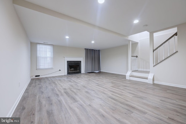 unfurnished living room featuring light hardwood / wood-style floors