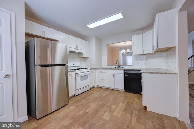 kitchen with tasteful backsplash, stainless steel refrigerator, black dishwasher, white cabinetry, and white range with gas stovetop