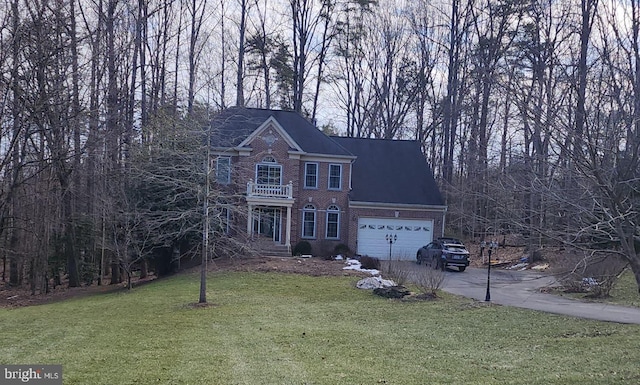 view of front of property with a balcony, driveway, a front lawn, a garage, and brick siding