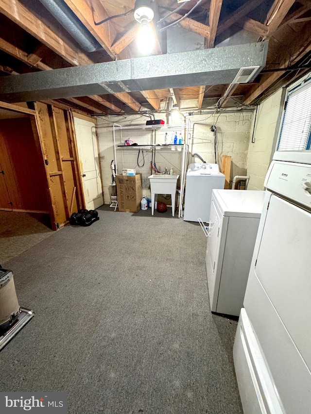 basement featuring washer and dryer