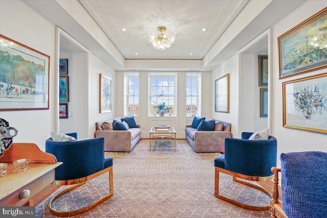 interior space featuring a chandelier and a tray ceiling