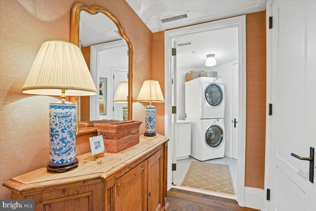 laundry room with stacked washer and clothes dryer