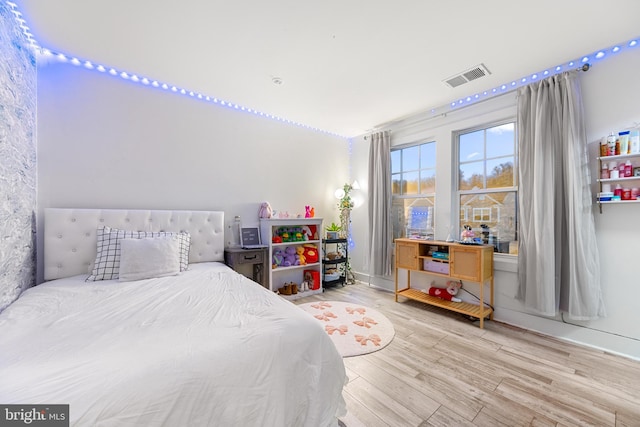 bedroom with hardwood / wood-style flooring