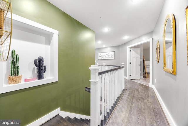 corridor featuring hardwood / wood-style flooring