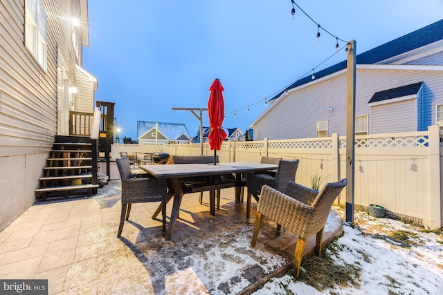 view of snow covered patio