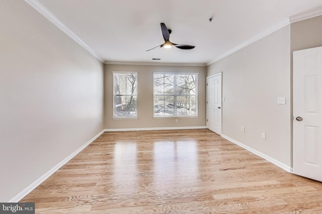 unfurnished room with ceiling fan, light wood-type flooring, and ornamental molding