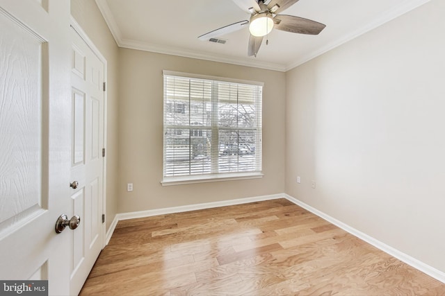 spare room with ceiling fan, crown molding, and light hardwood / wood-style flooring