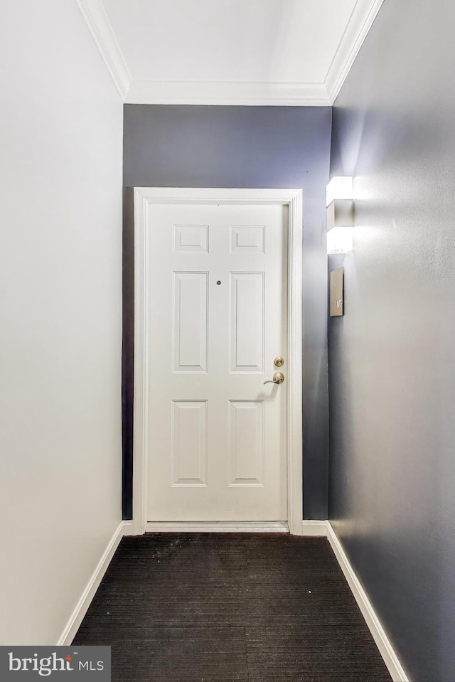 doorway to outside with ornamental molding