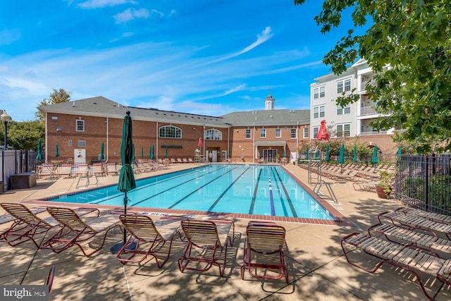 view of swimming pool with a patio area