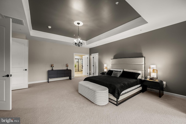 carpeted bedroom with a tray ceiling, a notable chandelier, visible vents, and baseboards