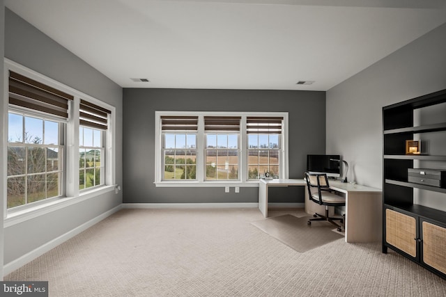 office area with visible vents, baseboards, and carpet floors