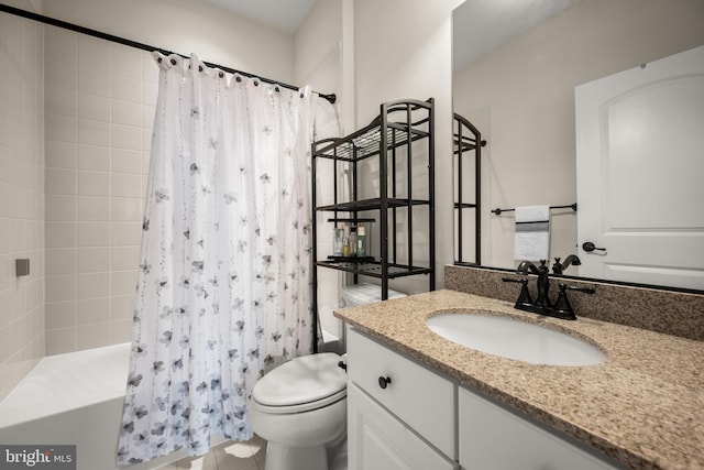 full bathroom with vanity, shower / tub combo, and toilet