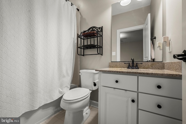 full bathroom with vanity, tile patterned floors, toilet, and shower / bath combo with shower curtain