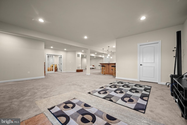 interior space with light carpet, recessed lighting, and baseboards