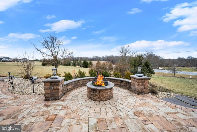 view of patio / terrace featuring a fire pit