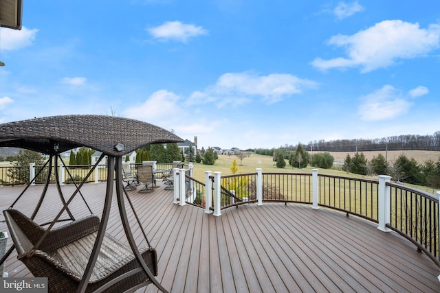 wooden terrace with outdoor dining space