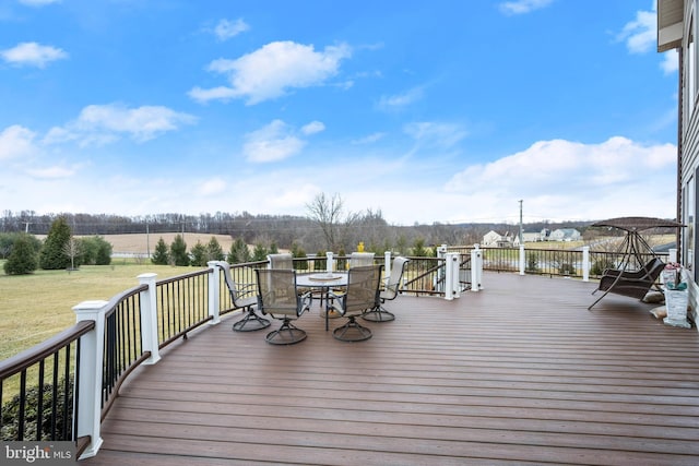 wooden terrace with outdoor dining area