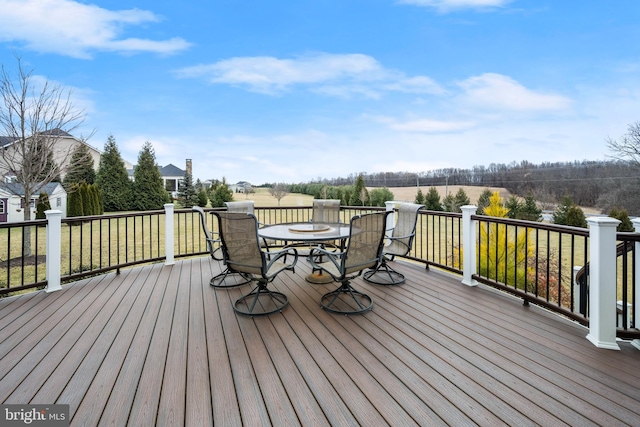 wooden deck with outdoor dining space