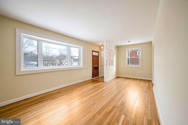 unfurnished room featuring light wood-type flooring