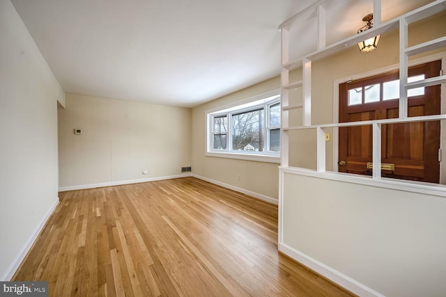 unfurnished room featuring wood-type flooring