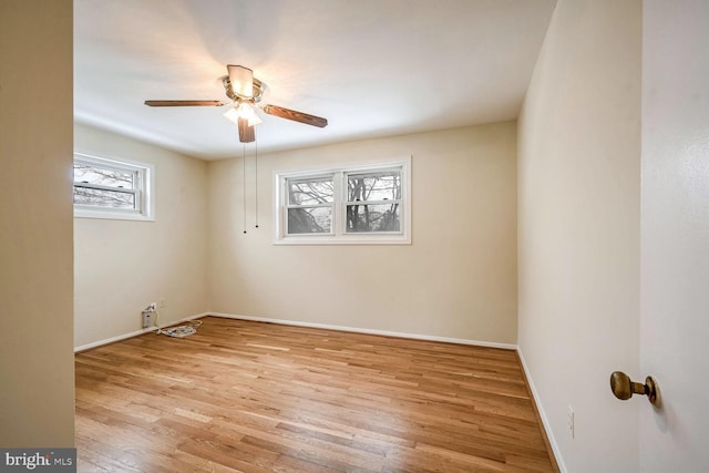 spare room with ceiling fan and light hardwood / wood-style floors