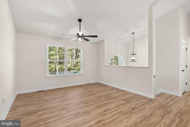 unfurnished room with ceiling fan, light hardwood / wood-style floors, and a wealth of natural light