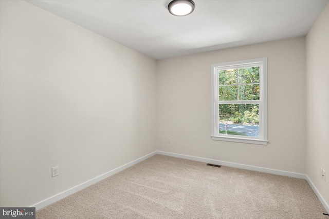 unfurnished room featuring carpet floors