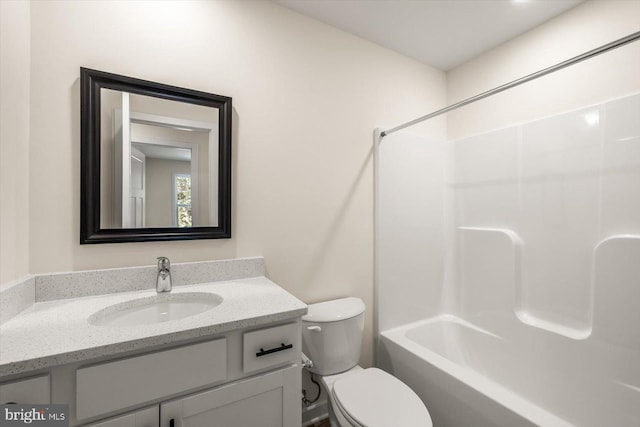 full bathroom with vanity, shower / bathtub combination, and toilet