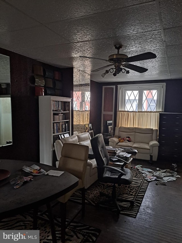 living room with hardwood / wood-style flooring and ceiling fan