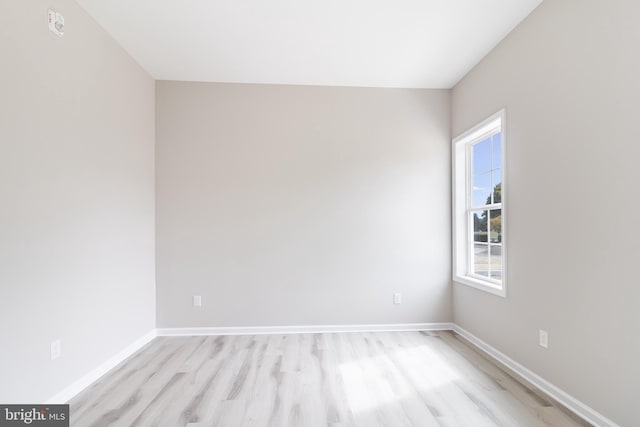 spare room with light hardwood / wood-style flooring