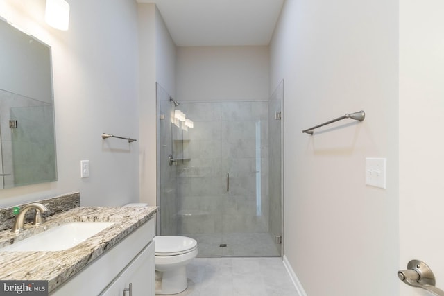 bathroom featuring tile patterned floors, toilet, vanity, and walk in shower