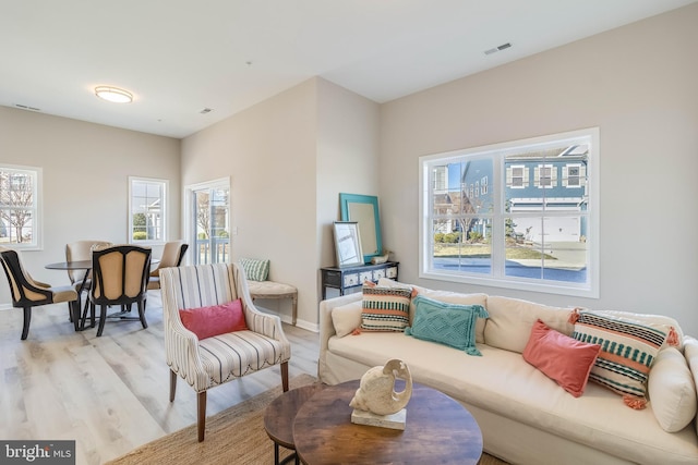 living room with light hardwood / wood-style flooring