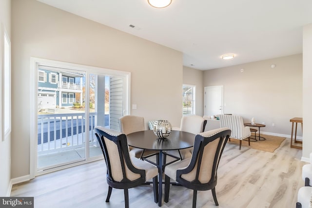 dining space featuring light hardwood / wood-style floors