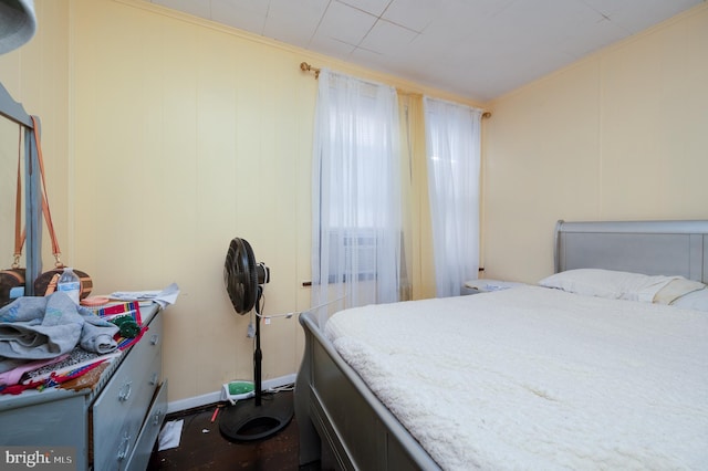 bedroom with ornamental molding