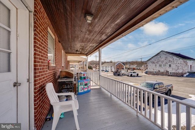 wooden deck featuring a porch