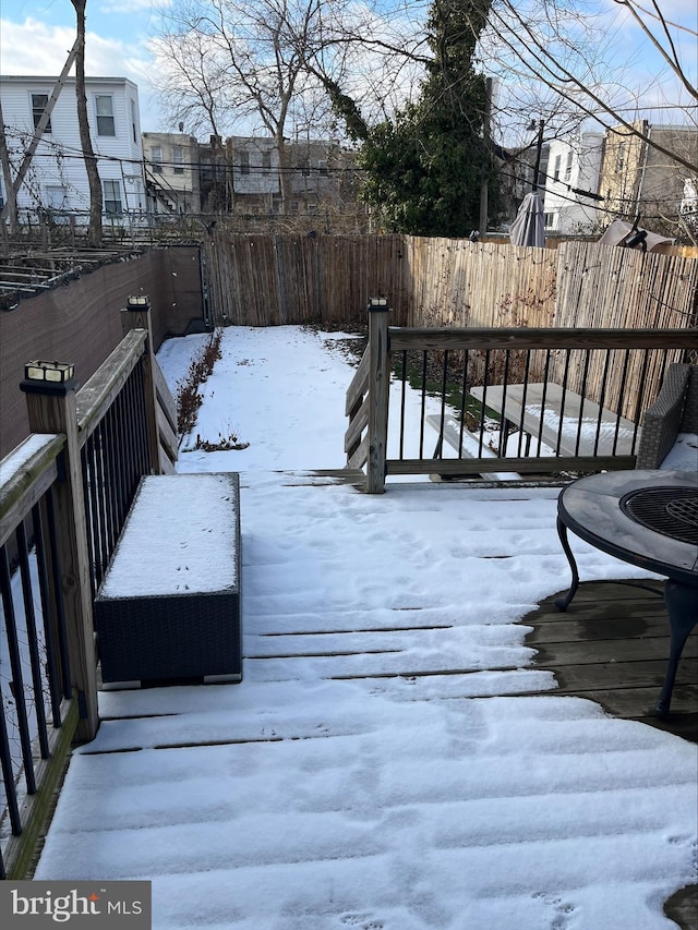 view of snow covered deck