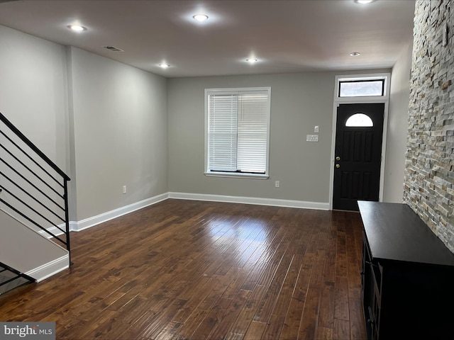 foyer featuring dark wood-type flooring