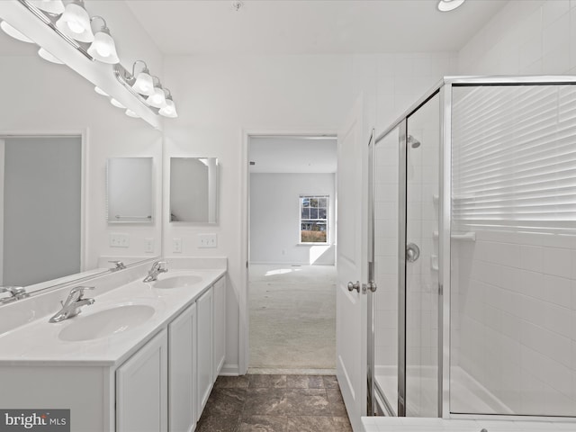 bathroom with walk in shower and vanity