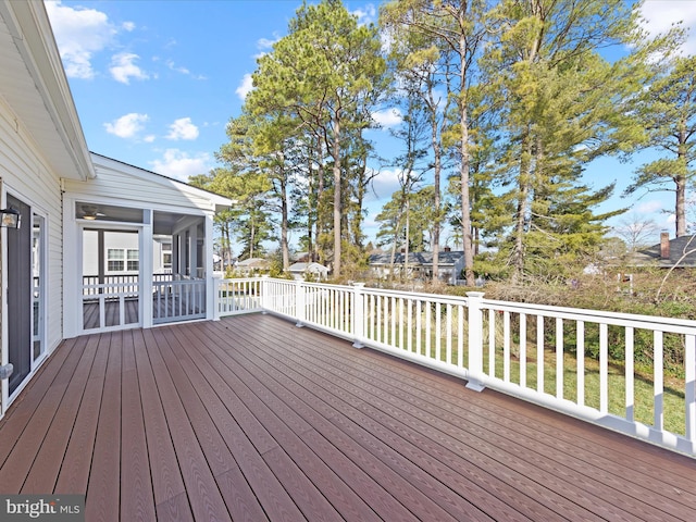 wooden terrace featuring a sunroom