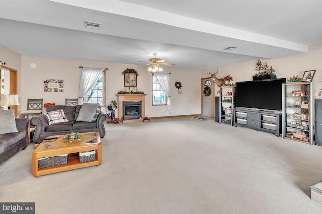 living room with ceiling fan and carpet floors