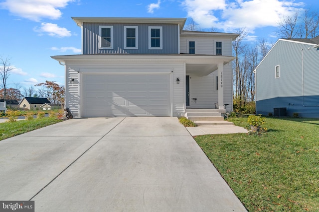 view of property with a front yard, a garage, and cooling unit