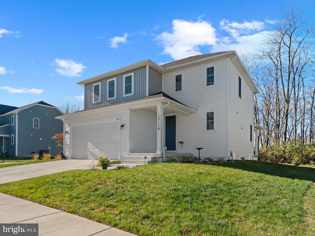 view of front of property with a garage and a front lawn