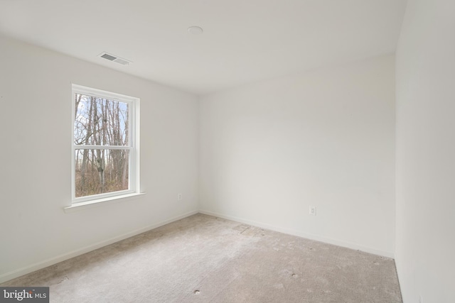 empty room with light colored carpet