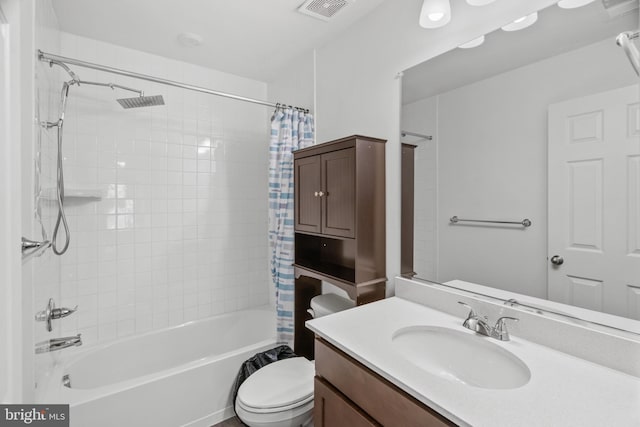 full bathroom featuring shower / bath combo with shower curtain, vanity, and toilet