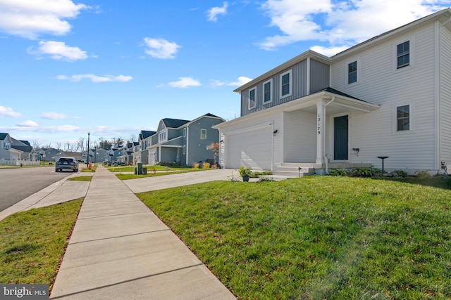 view of home's exterior with a lawn and a garage