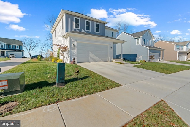 view of property with a front yard and a garage