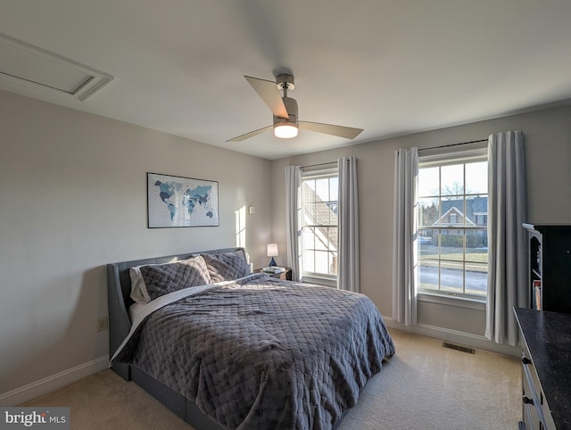 bedroom featuring ceiling fan and light carpet