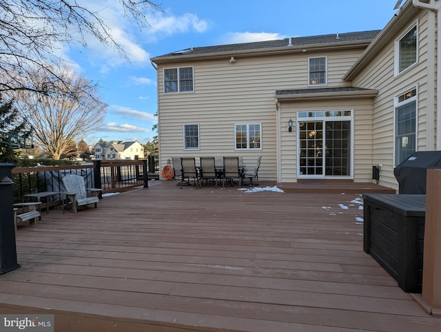 wooden deck with a grill